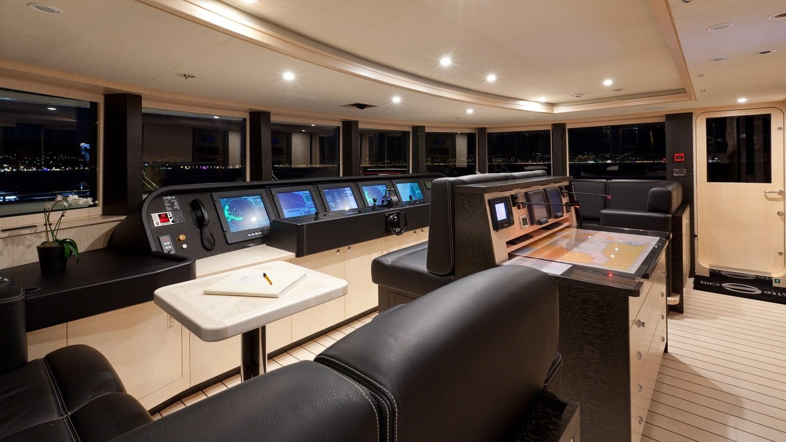 a room with a desk and chairs aboard STEP ONE Yacht for Sale