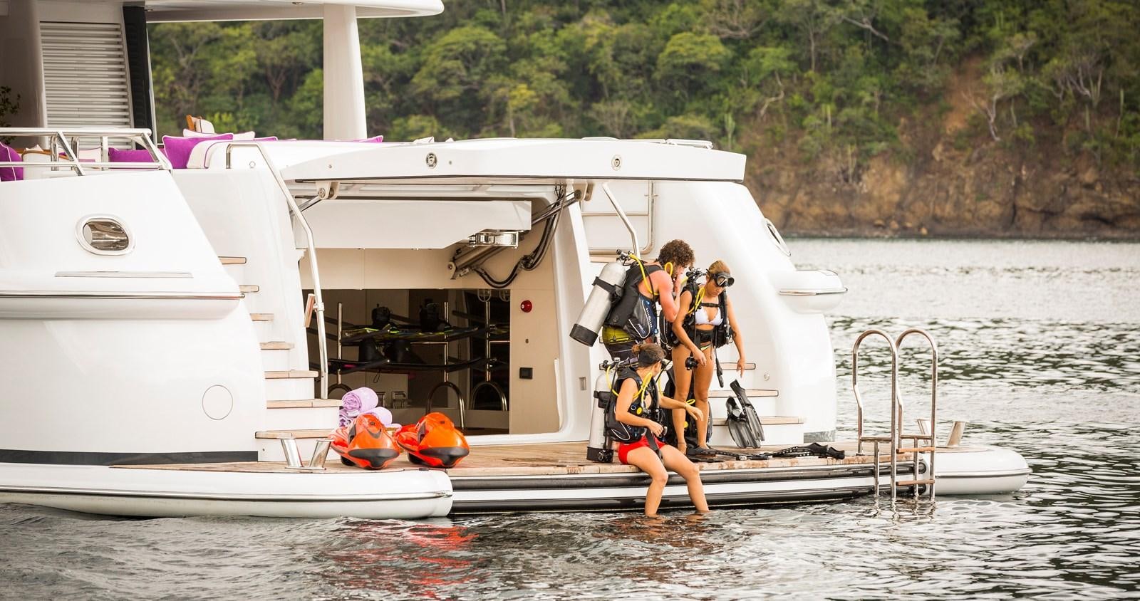 a group of people on a boat aboard STEP ONE Yacht for Sale