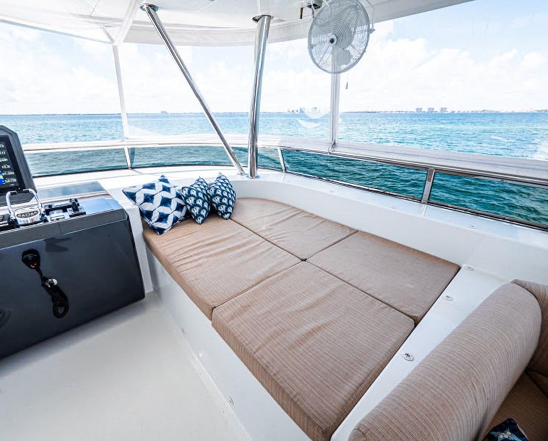 a deck with a fan and a fan aboard PHOENIX Yacht for Sale