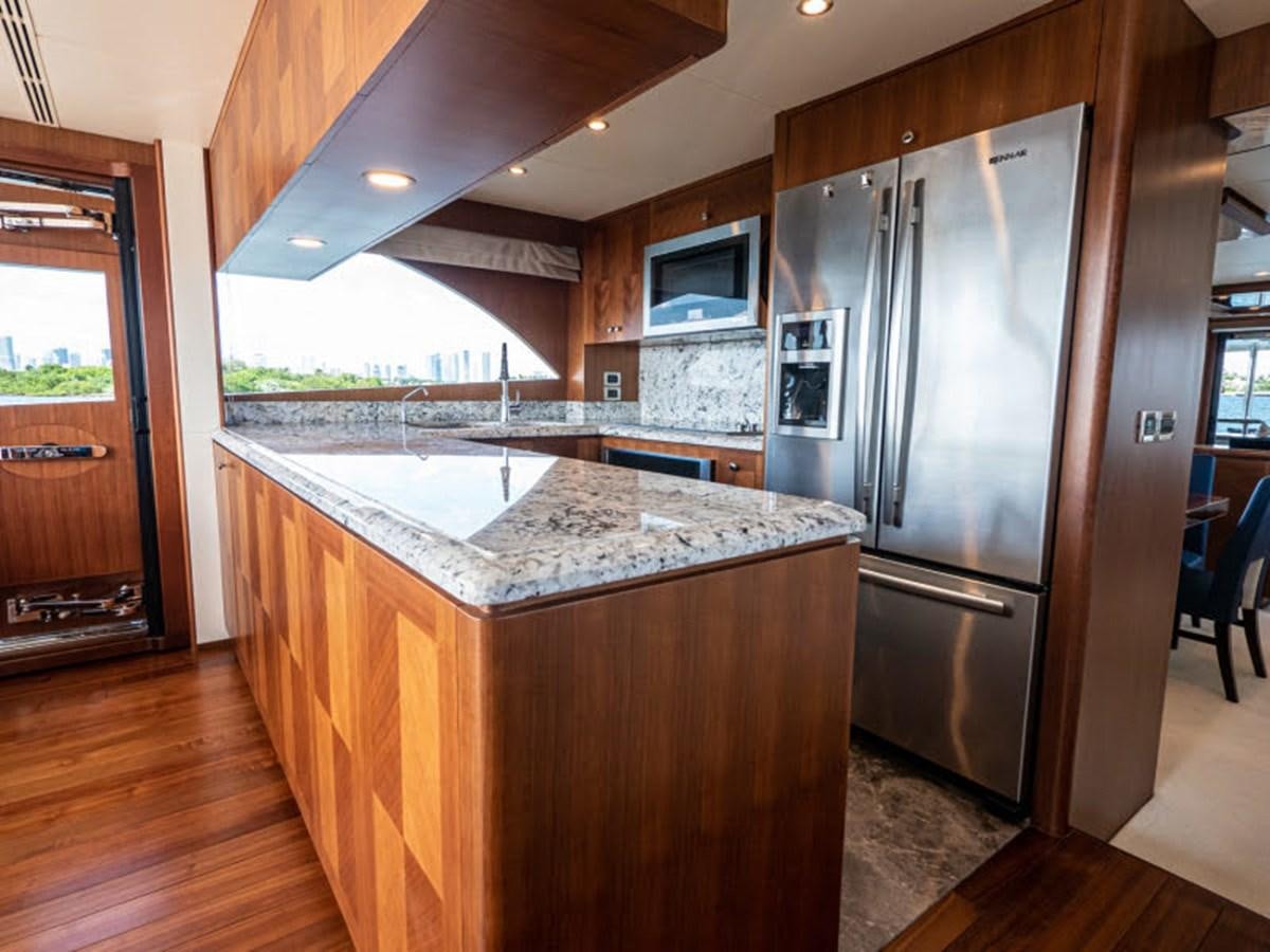 a kitchen with a large island aboard PHOENIX Yacht for Sale