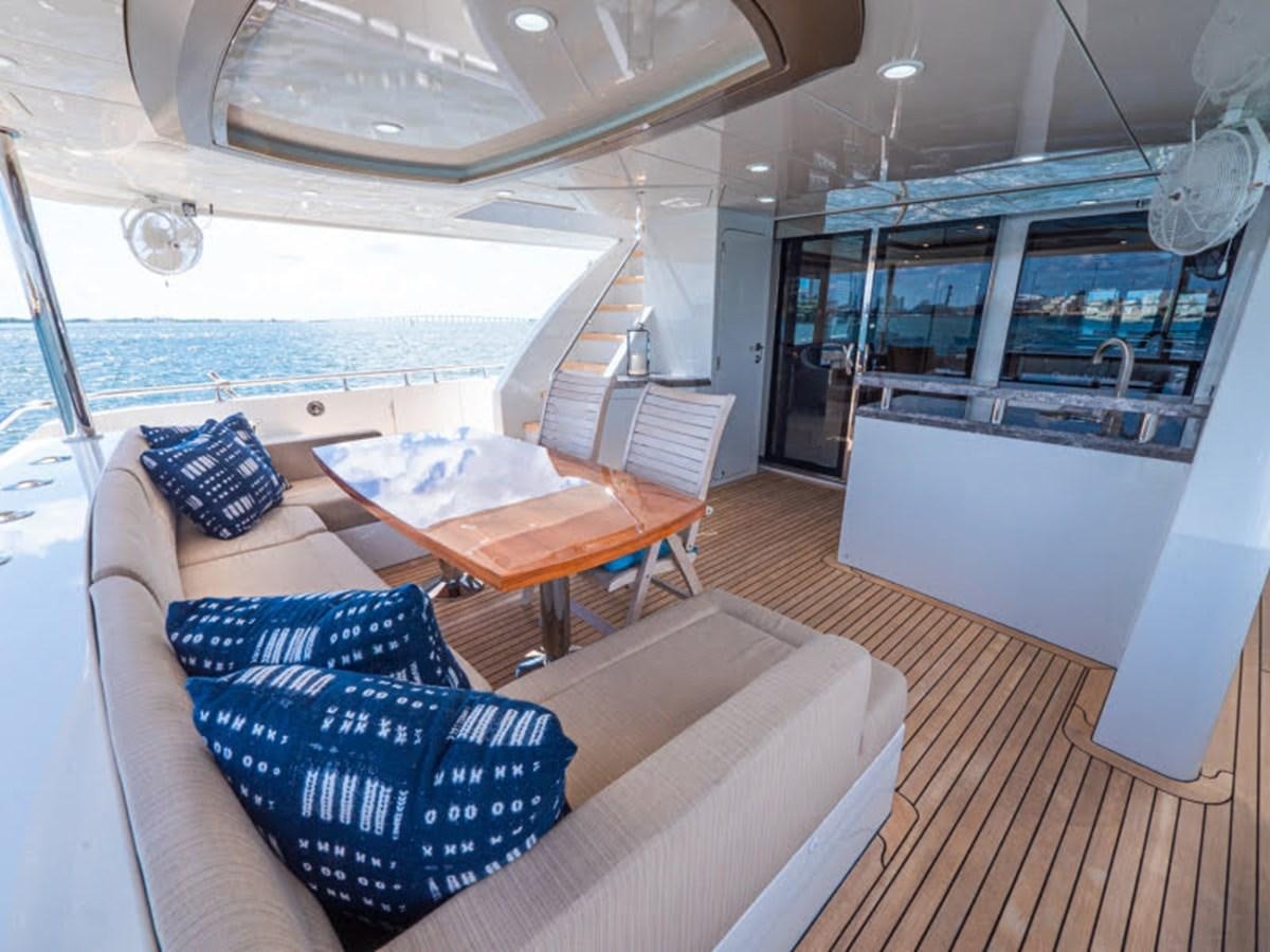 a room with a table and chairs aboard PHOENIX Yacht for Sale