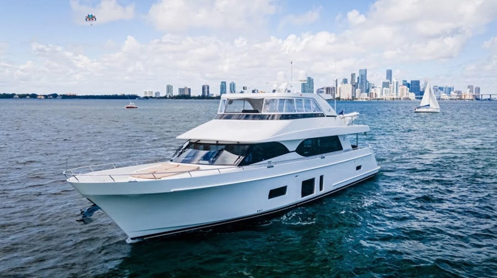 a white yacht in the water aboard PHOENIX Yacht for Sale