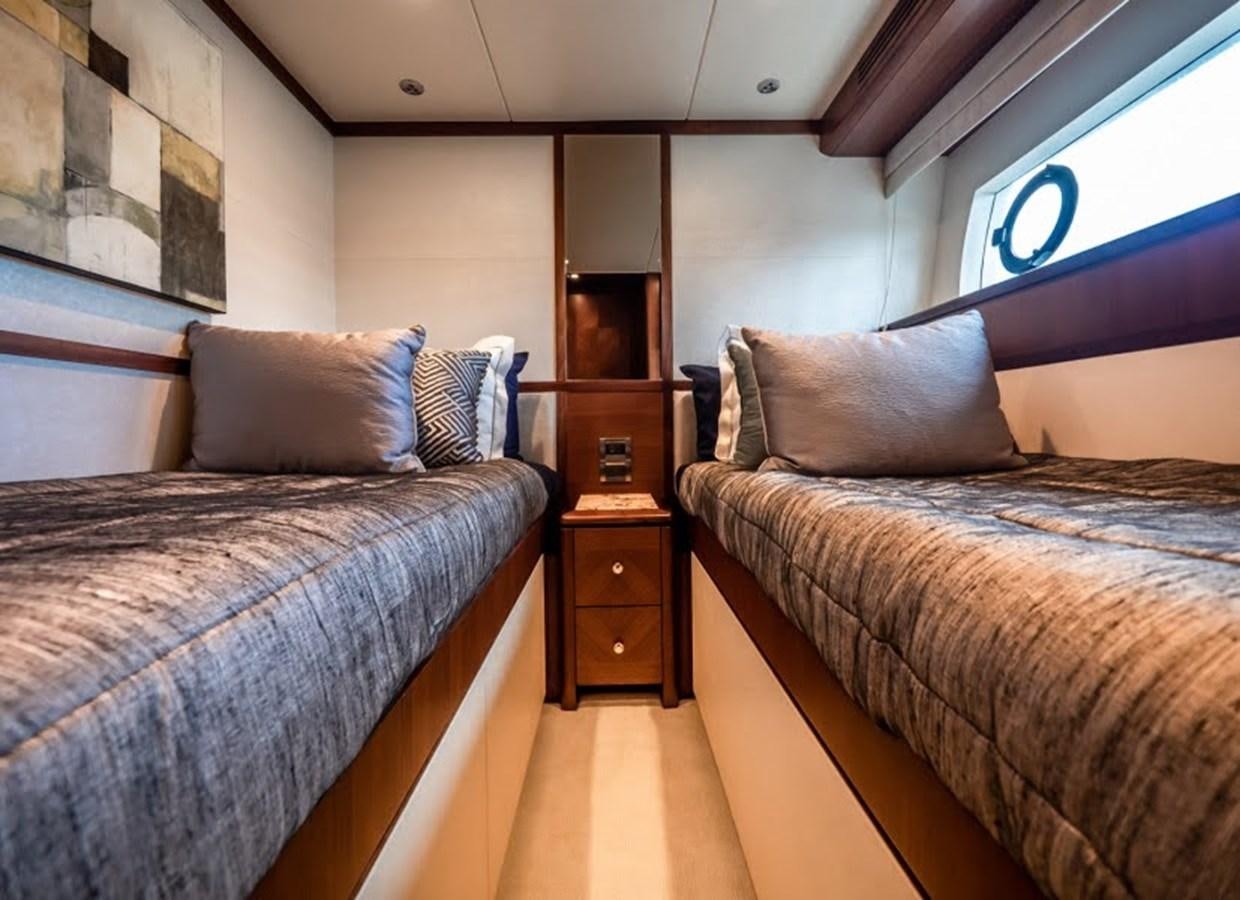 a couple of beds in a room aboard PHOENIX Yacht for Sale