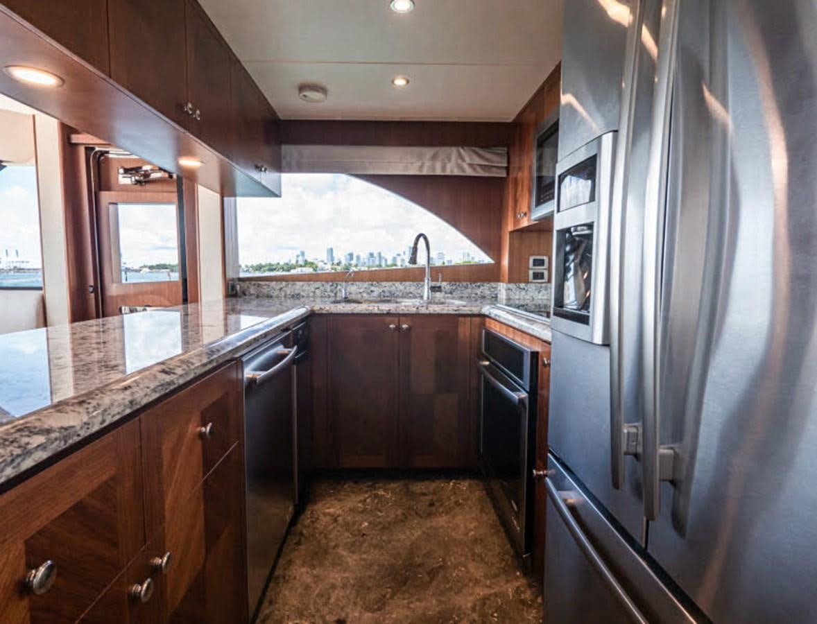 a kitchen with a large island aboard PHOENIX Yacht for Sale