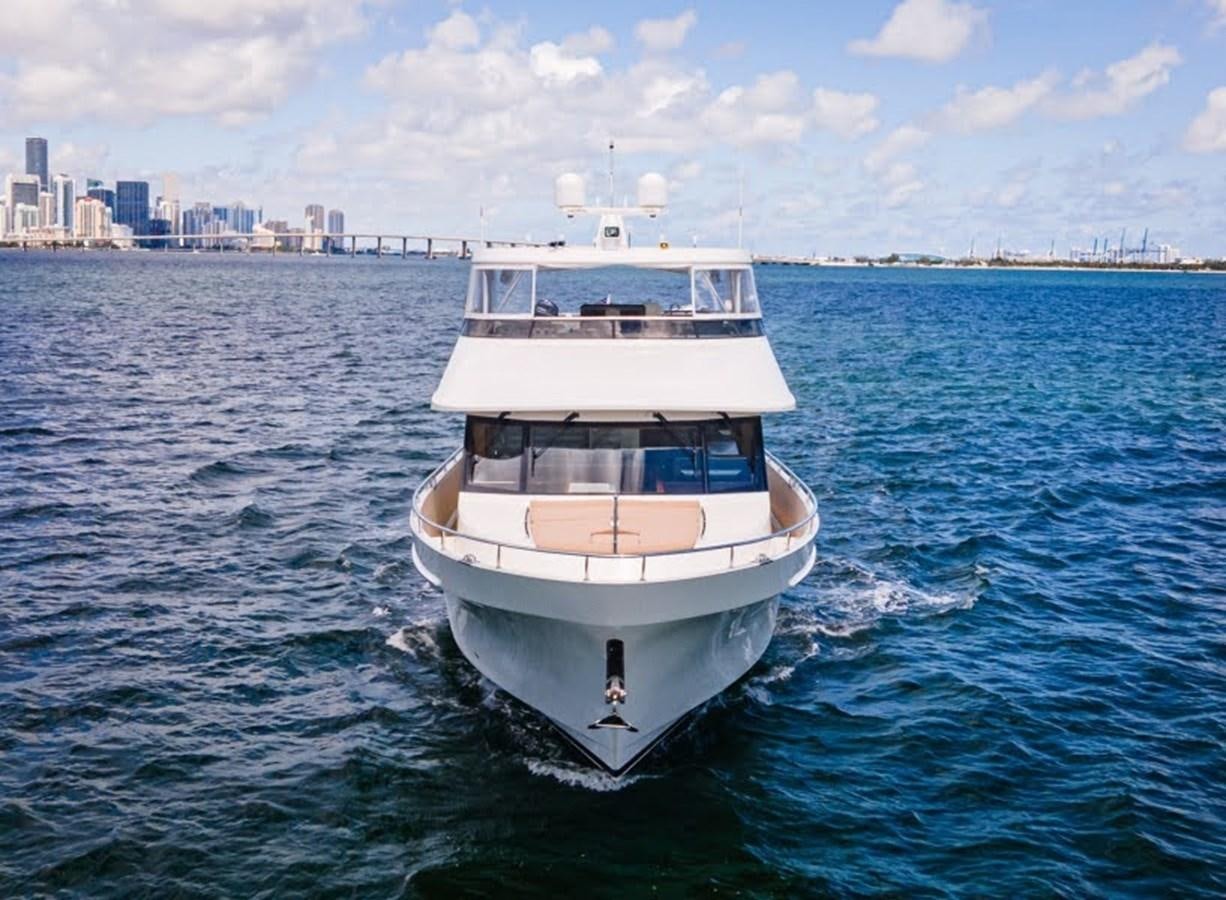 a white boat in the water aboard PHOENIX Yacht for Sale