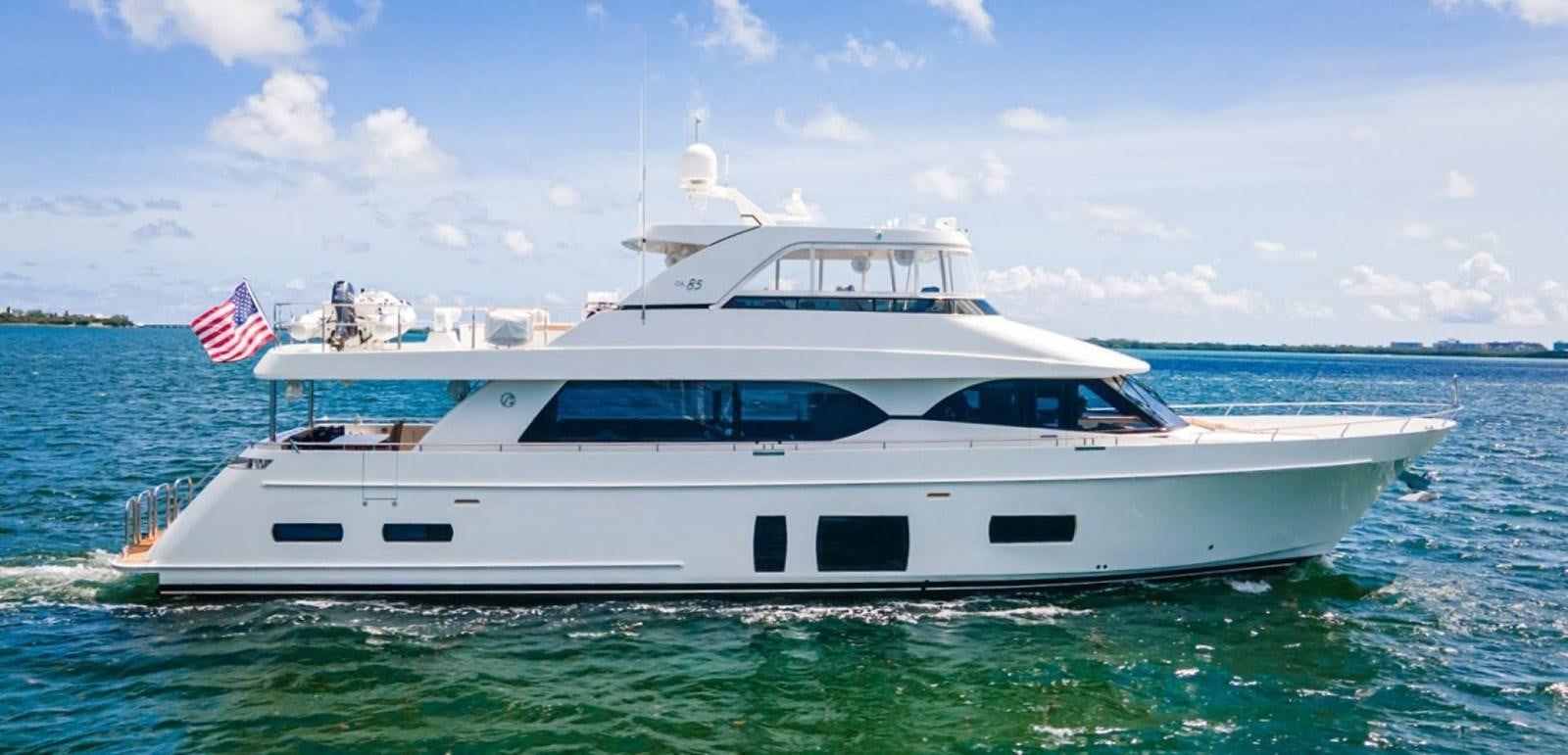 a white yacht in the water aboard PHOENIX Yacht for Sale