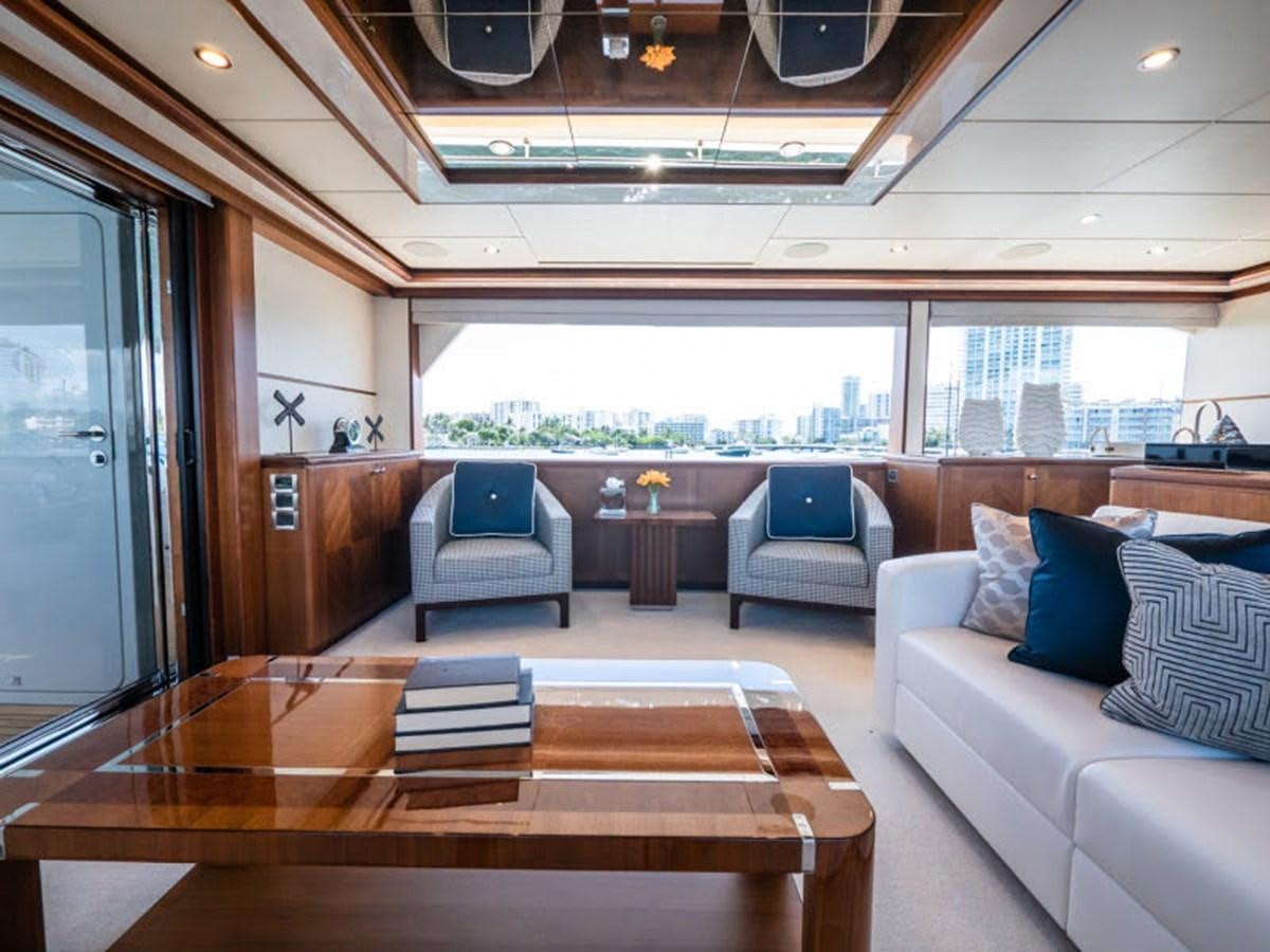 a living room with a large window aboard PHOENIX Yacht for Sale