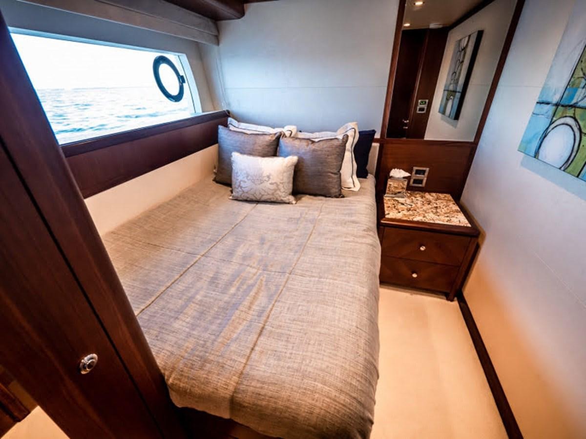 a bed in a room aboard PHOENIX Yacht for Sale