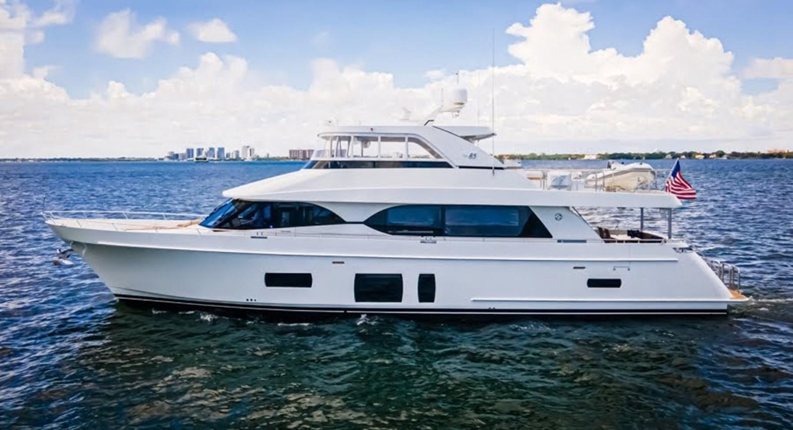 a white yacht in the water aboard PHOENIX Yacht for Sale