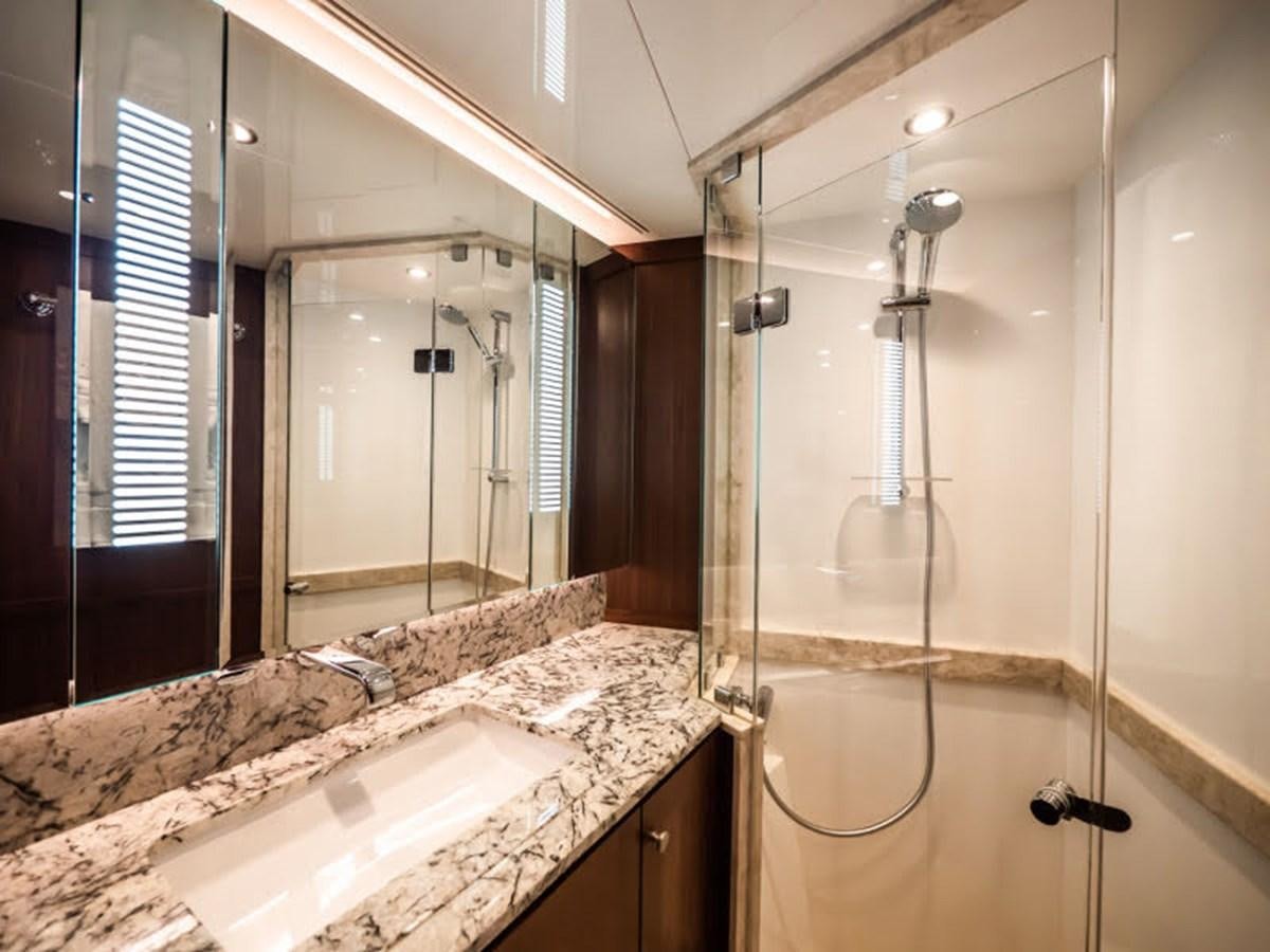 a bathroom with a large marble countertop aboard PHOENIX Yacht for Sale