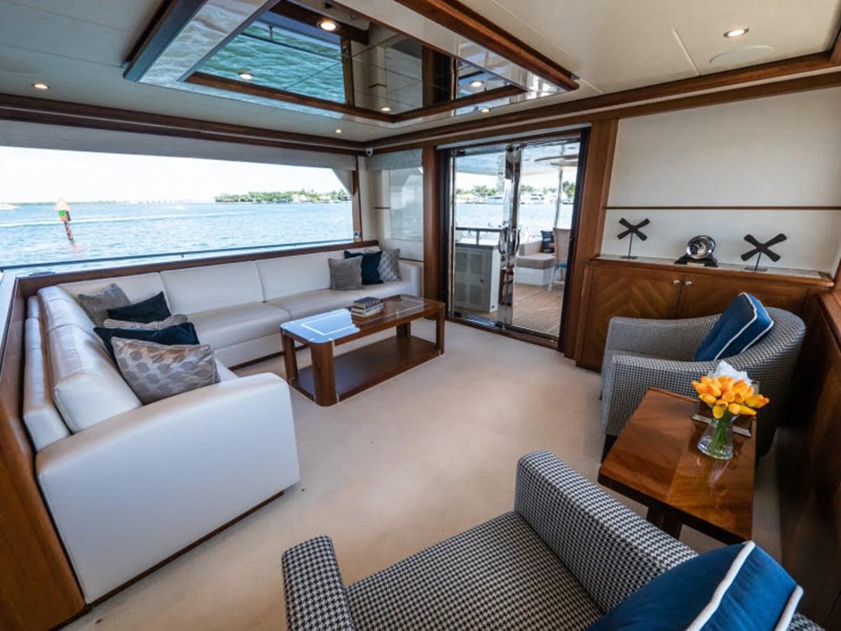 a living room with a large window aboard PHOENIX Yacht for Sale