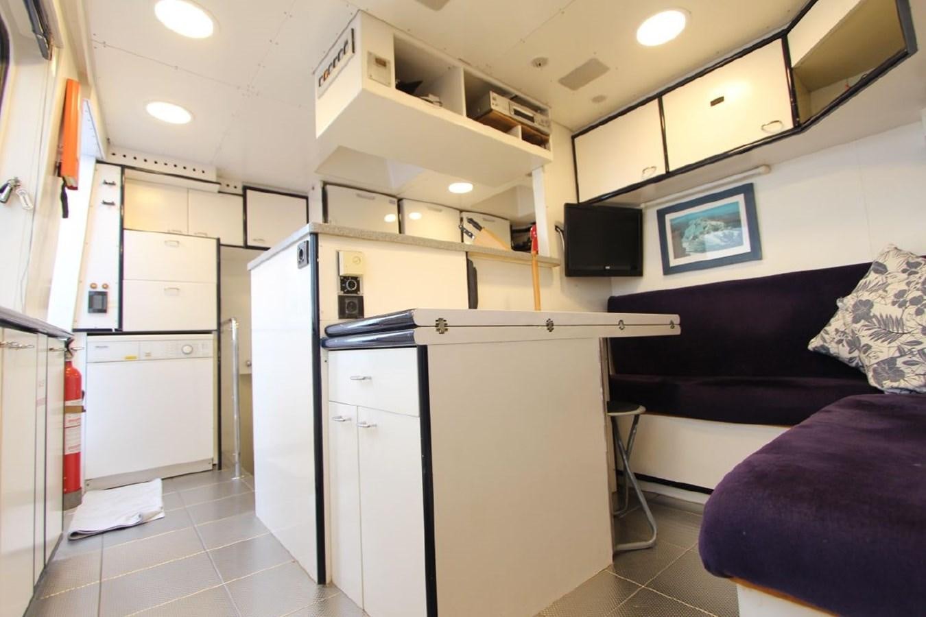 a room with a couch and a tv aboard LURSSEN FBMY Yacht for Sale