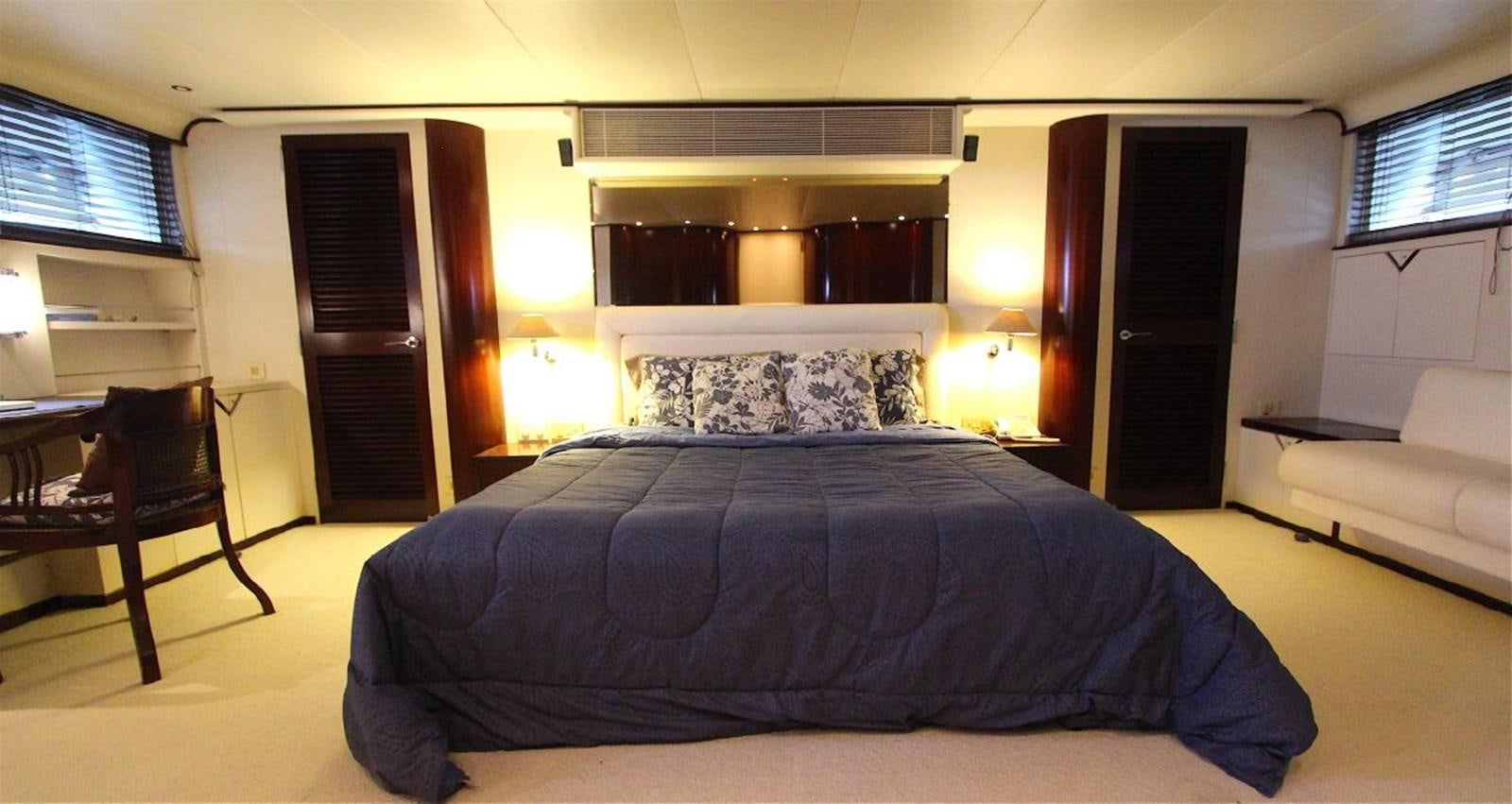 a bed in a room aboard LURSSEN FBMY Yacht for Sale