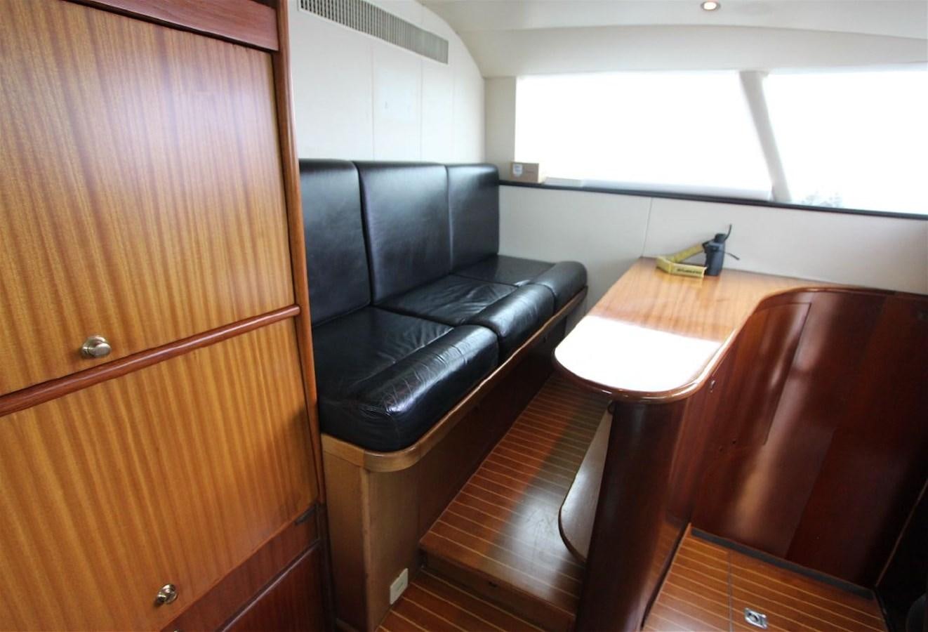 a chair and desk in a room aboard LURSSEN FBMY Yacht for Sale
