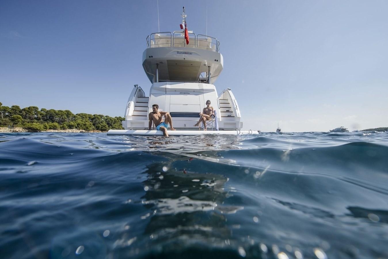a group of people on a boat aboard SUNSEEKER 76 YACHT Yacht for Sale