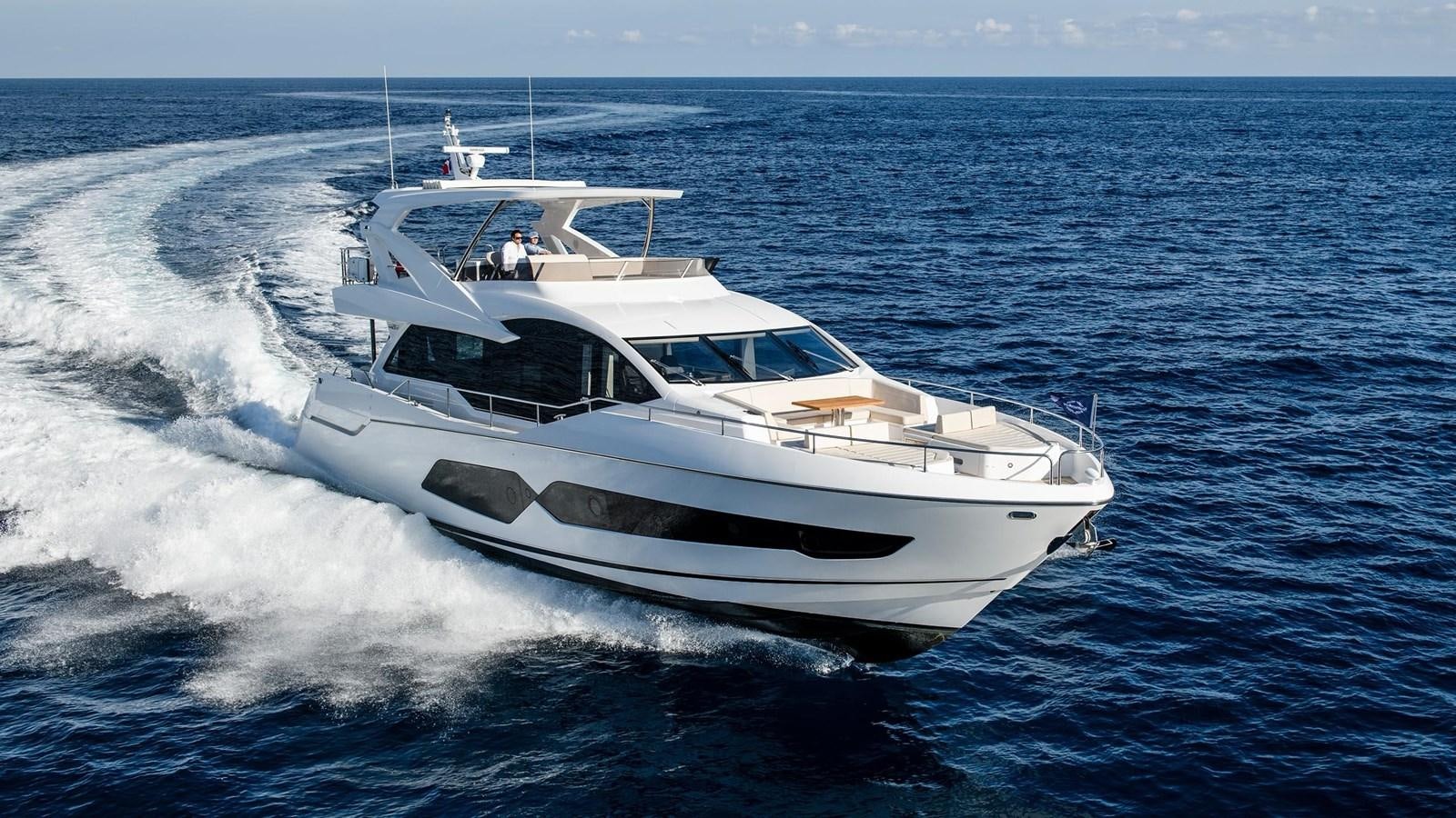 a white yacht on the water aboard SUNSEEKER 76 YACHT Yacht for Sale
