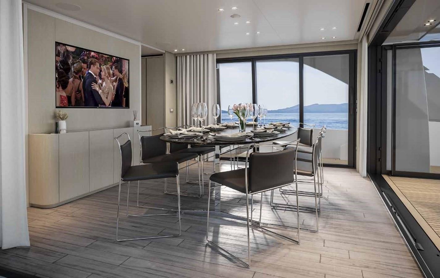 a room with a table and chairs aboard AM Yacht for Sale