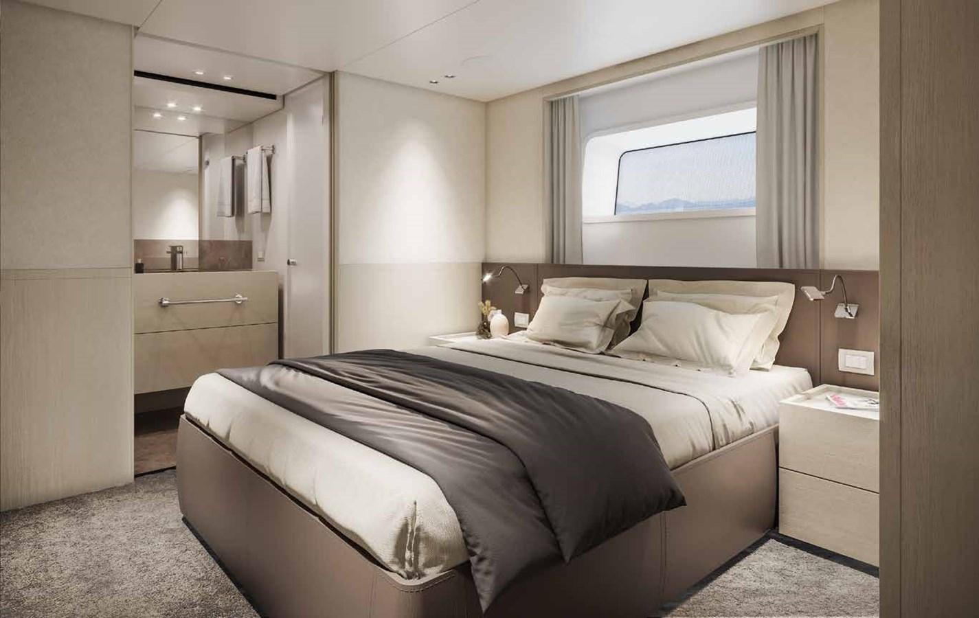a bedroom with a bed and a mirror aboard AM Yacht for Sale