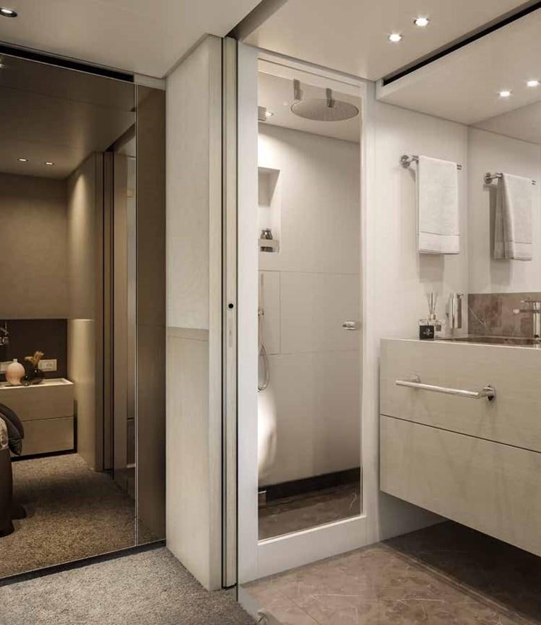 a bathroom with a glass shower aboard AM Yacht for Sale