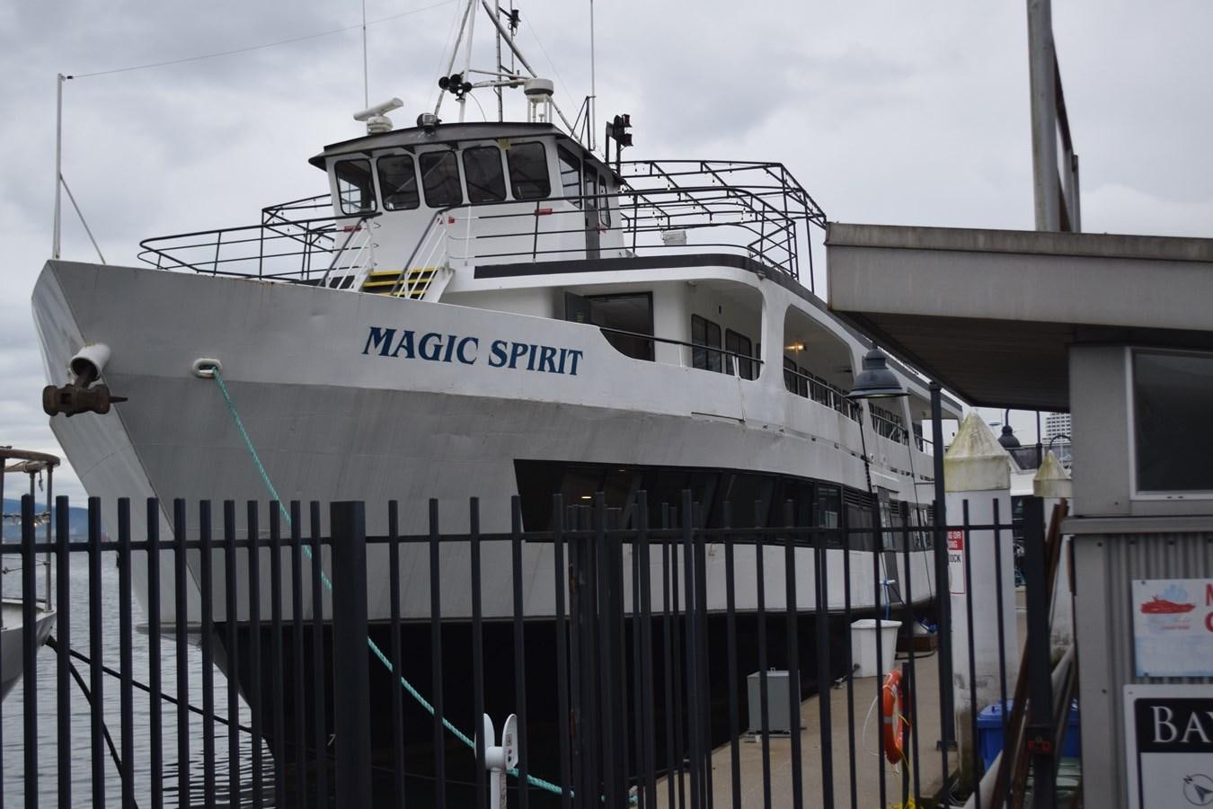 a large white boat on a metal fence aboard MAGIC SPIRIT Yacht for Sale