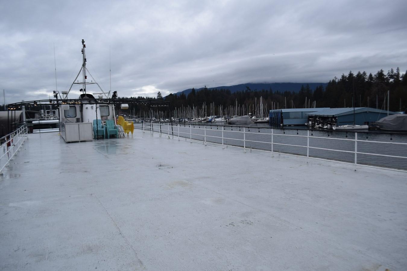 a large ice rink with a large crane and a building in the background aboard MAGIC SPIRIT Yacht for Sale