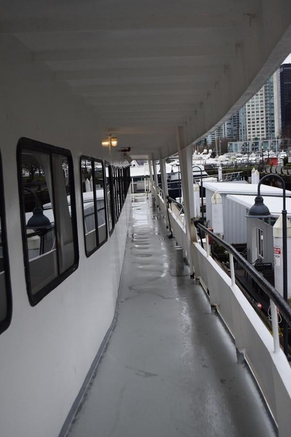 a long hallway with a light on the side aboard MAGIC SPIRIT Yacht for Sale
