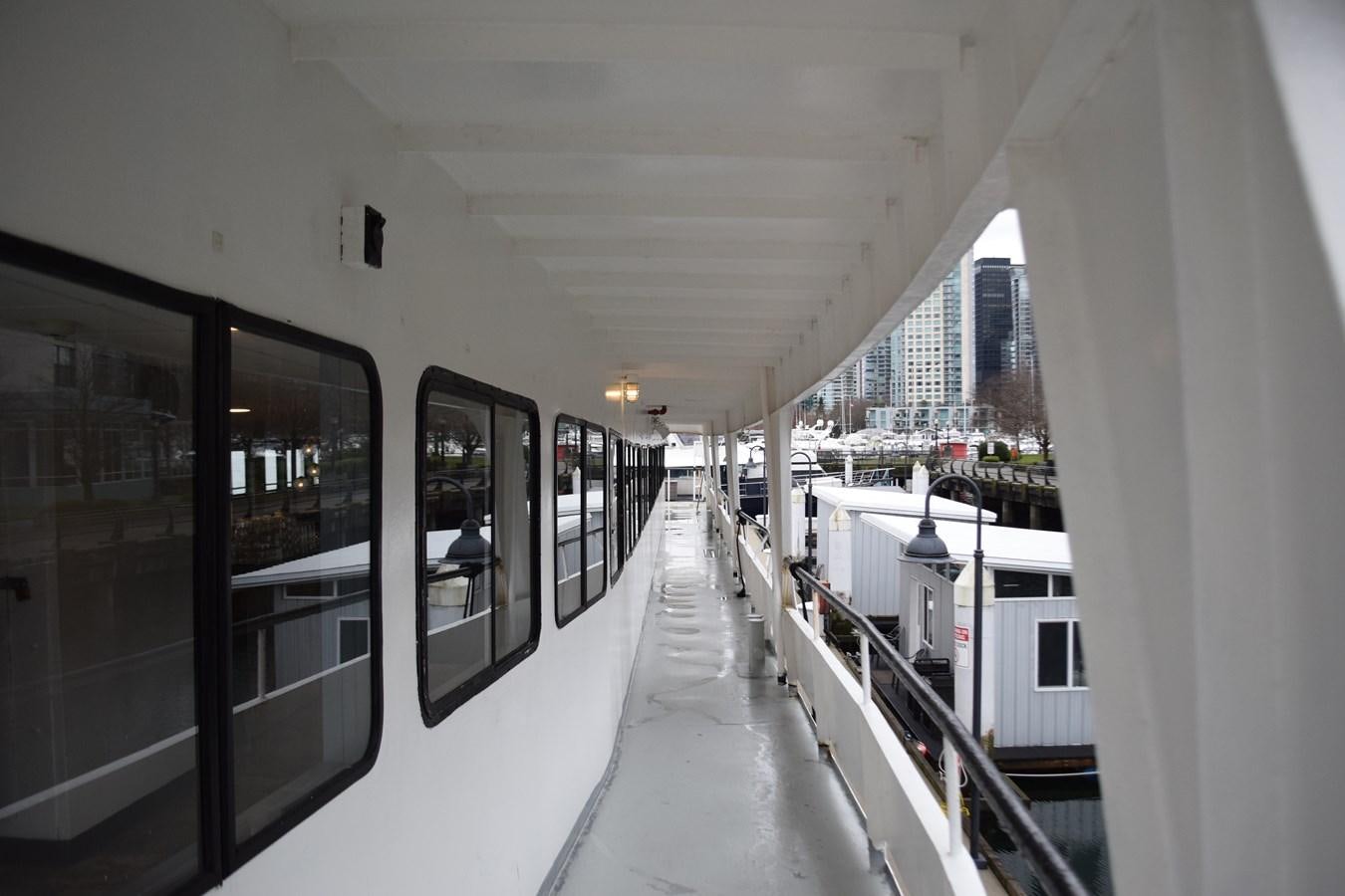 a hallway with windows and doors aboard MAGIC SPIRIT Yacht for Sale