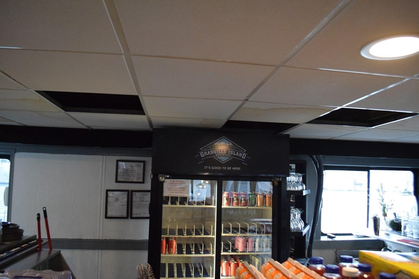 a store with shelves and bottles aboard MAGIC SPIRIT Yacht for Sale