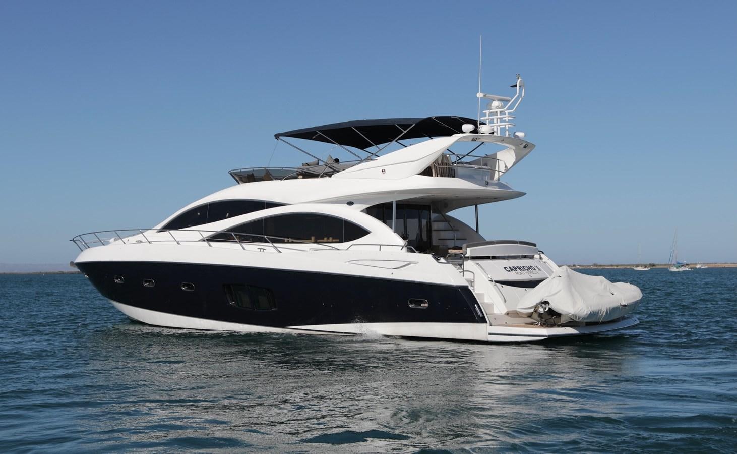 a white yacht on the water aboard CAPRICHO II Yacht for Sale