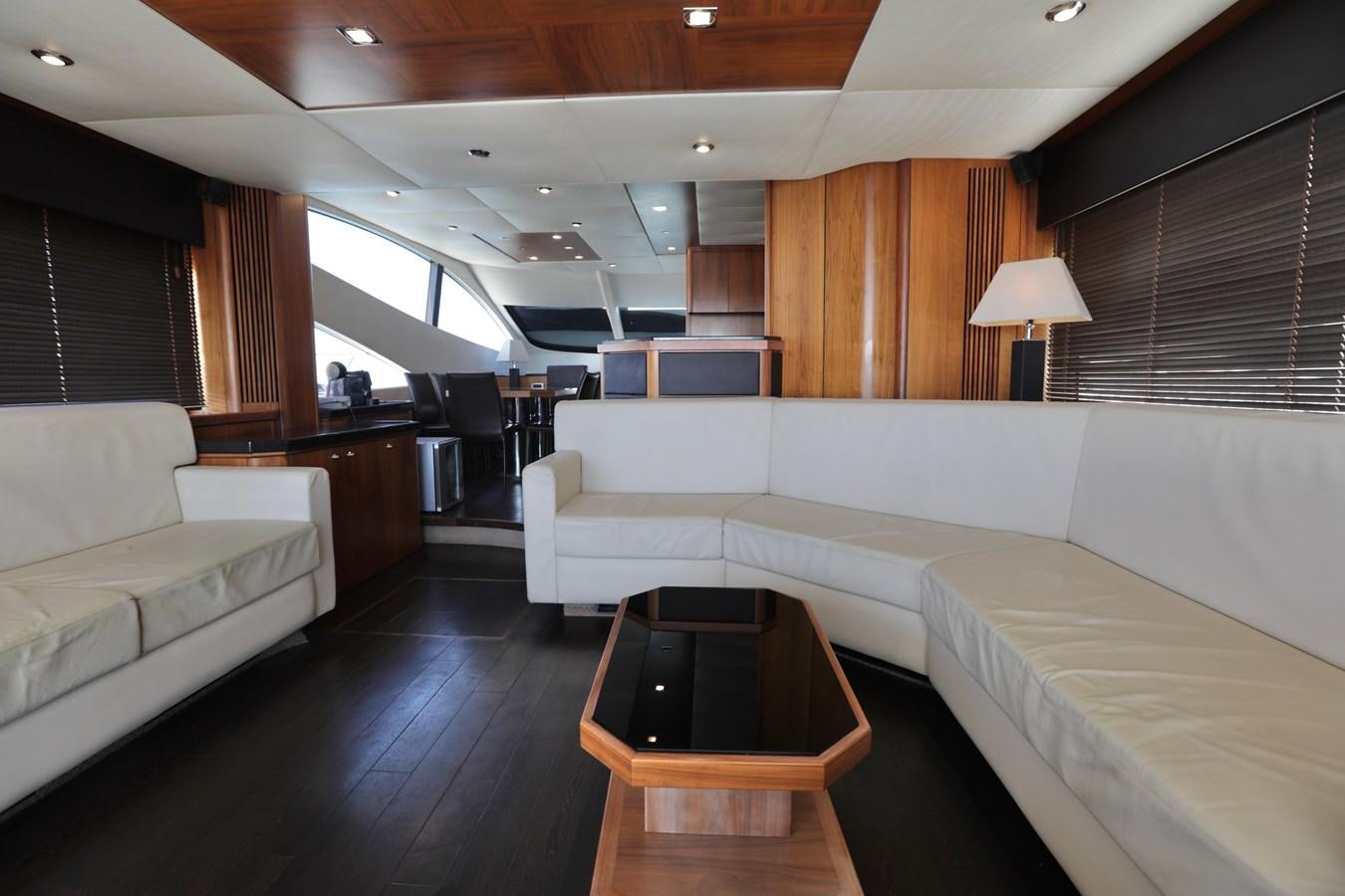 a room with a bed and a table aboard CAPRICHO II Yacht for Sale