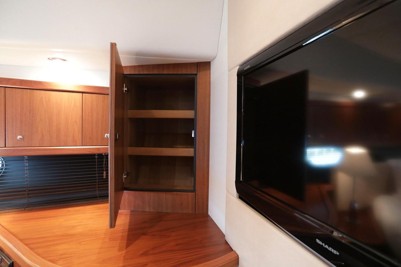 a tv in a room aboard CAPRICHO II Yacht for Sale