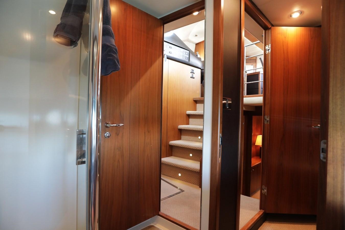 a room with wooden doors aboard CAPRICHO II Yacht for Sale
