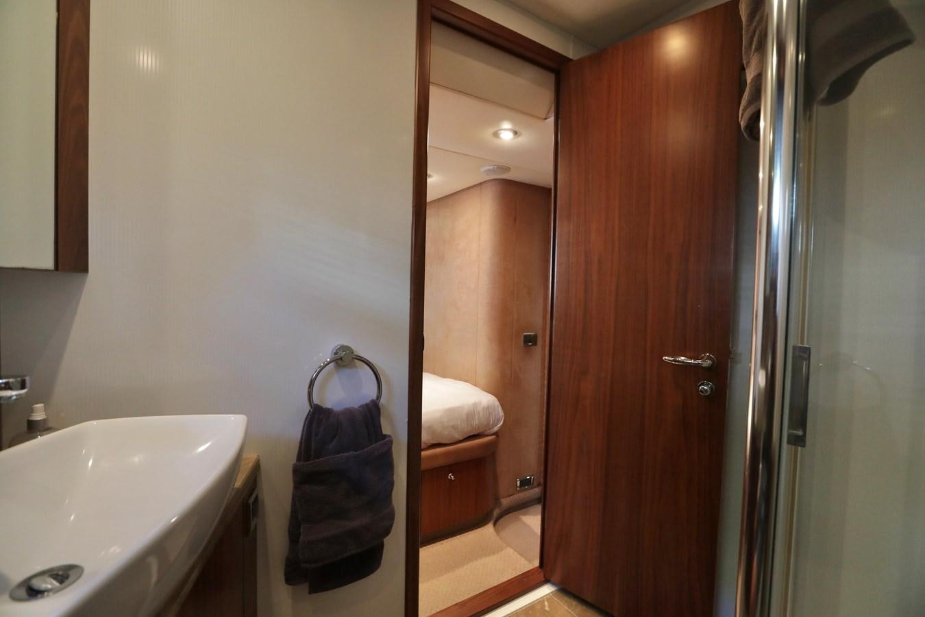 a bathroom with a sink and a mirror aboard CAPRICHO II Yacht for Sale