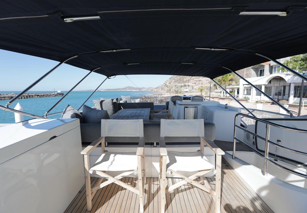 a deck with chairs on it aboard CAPRICHO II Yacht for Sale