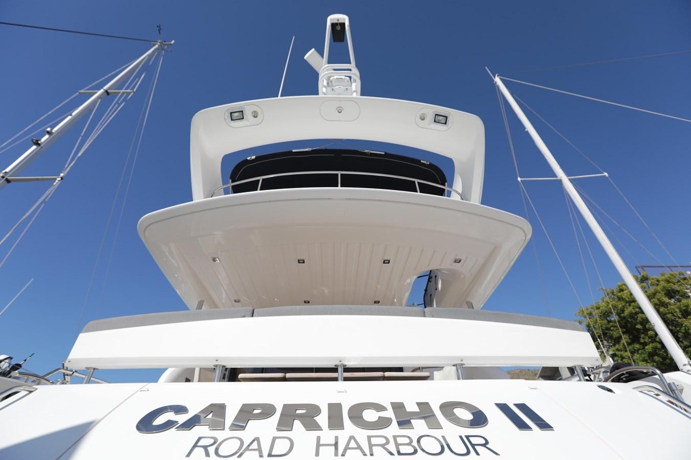 a white and black boat aboard CAPRICHO II Yacht for Sale