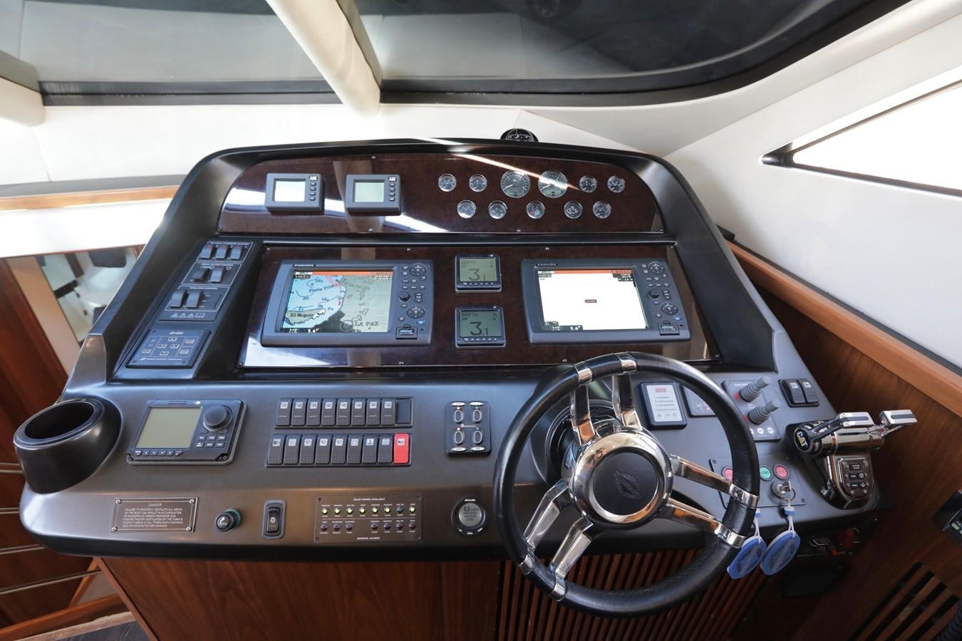 a car stereo with a screen and buttons aboard CAPRICHO II Yacht for Sale