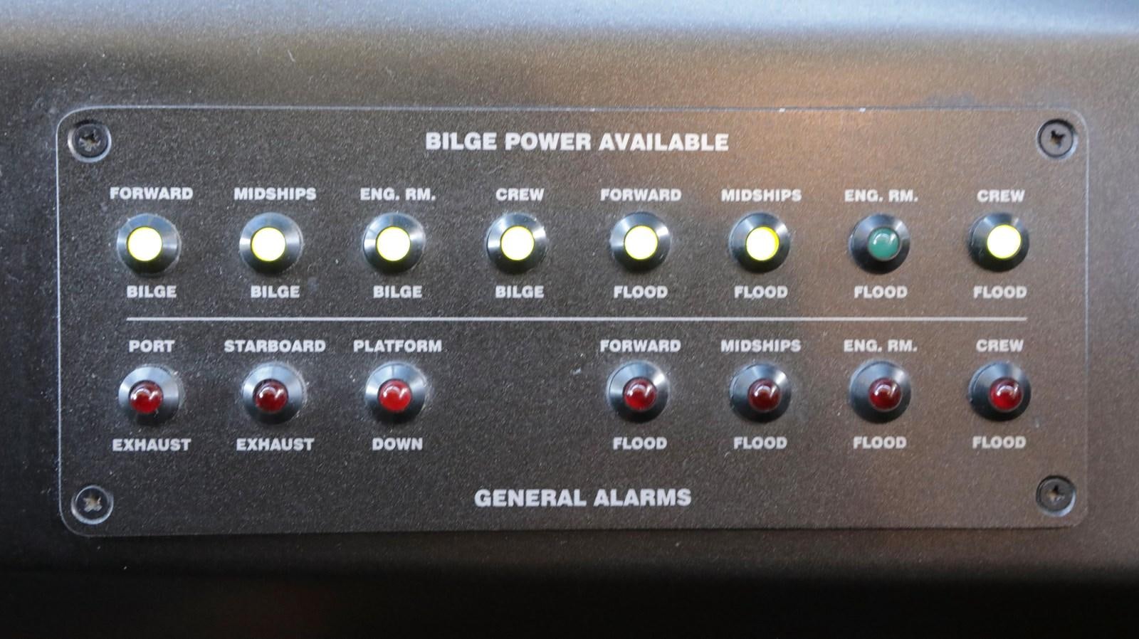 a black control panel with buttons and dials aboard CAPRICHO II Yacht for Sale