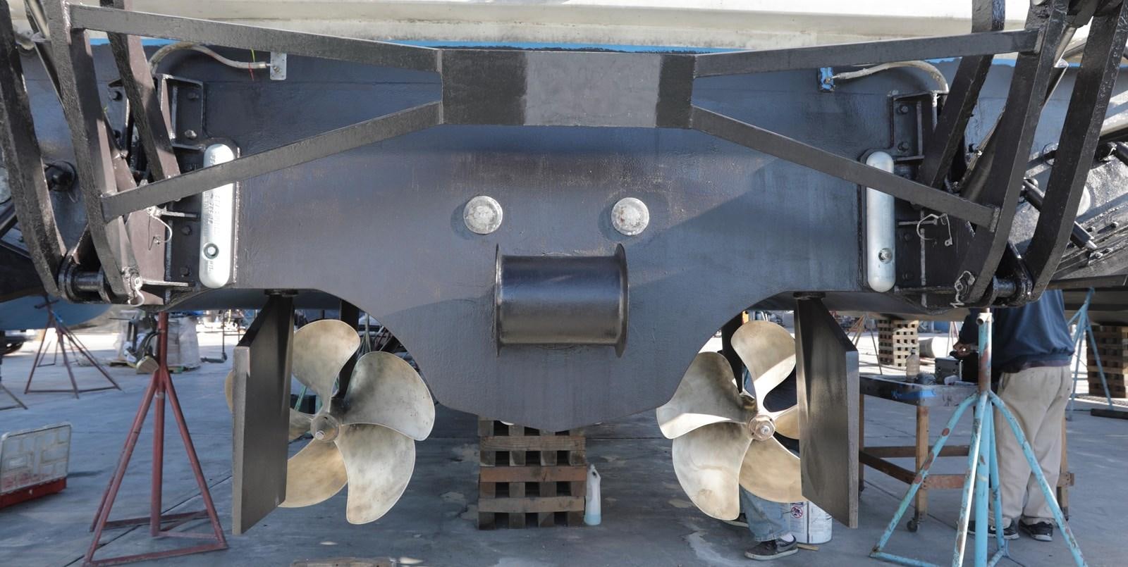 a few men working on a machine aboard CAPRICHO II Yacht for Sale
