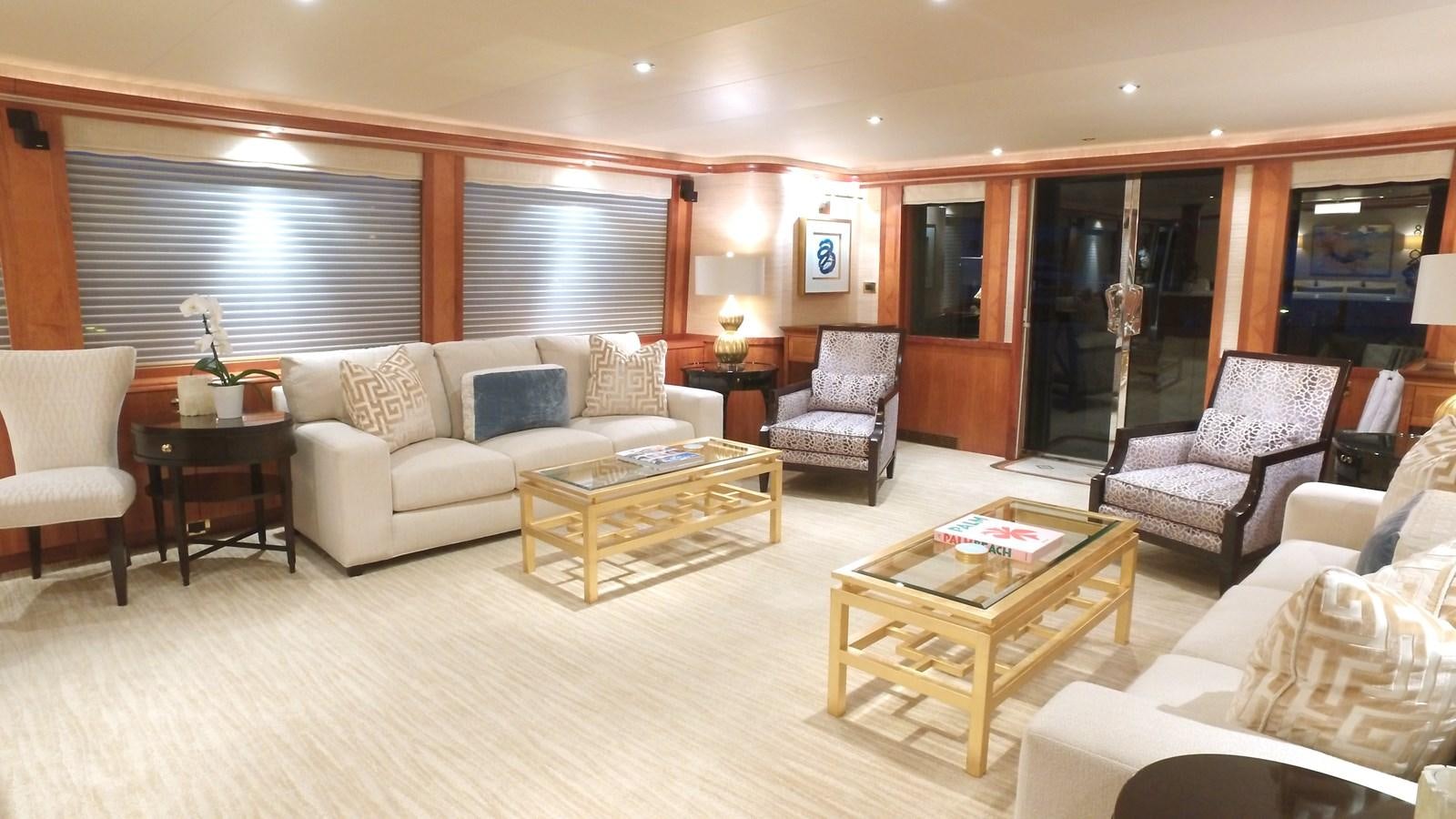 a living room with a couch and a coffee table aboard SHORT GAME Yacht for Sale