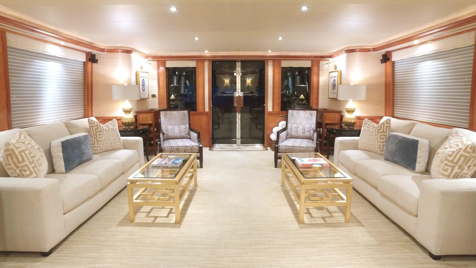 a living room with a couch and a coffee table aboard SHORT GAME Yacht for Sale