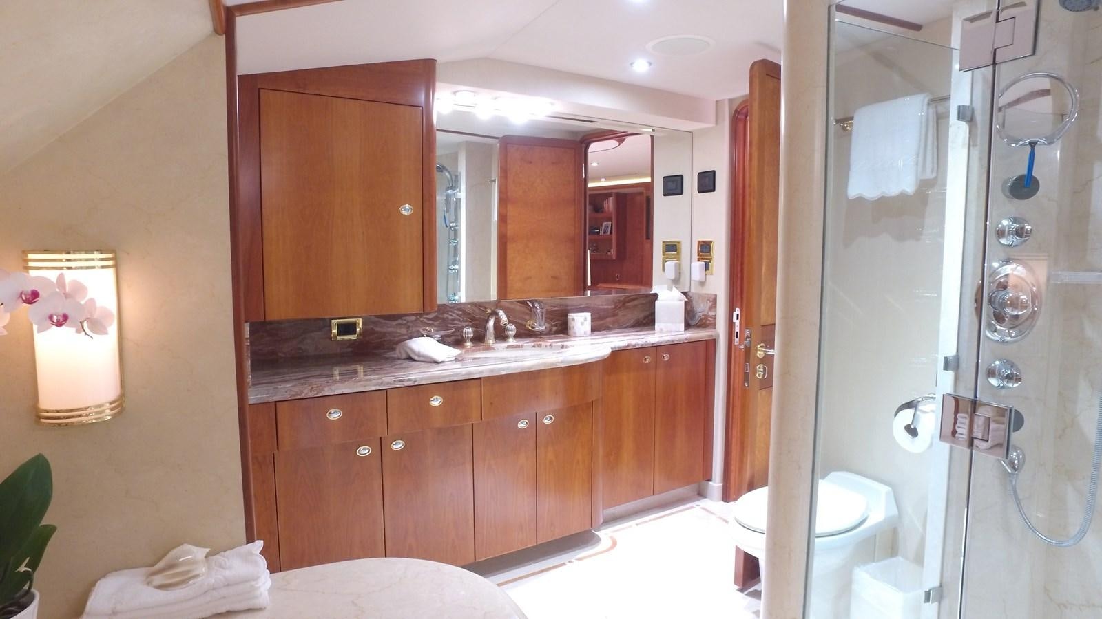 a bathroom with a large mirror aboard SHORT GAME Yacht for Sale