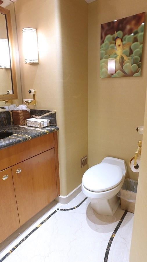 a bathroom with a toilet and a sink aboard SHORT GAME Yacht for Sale