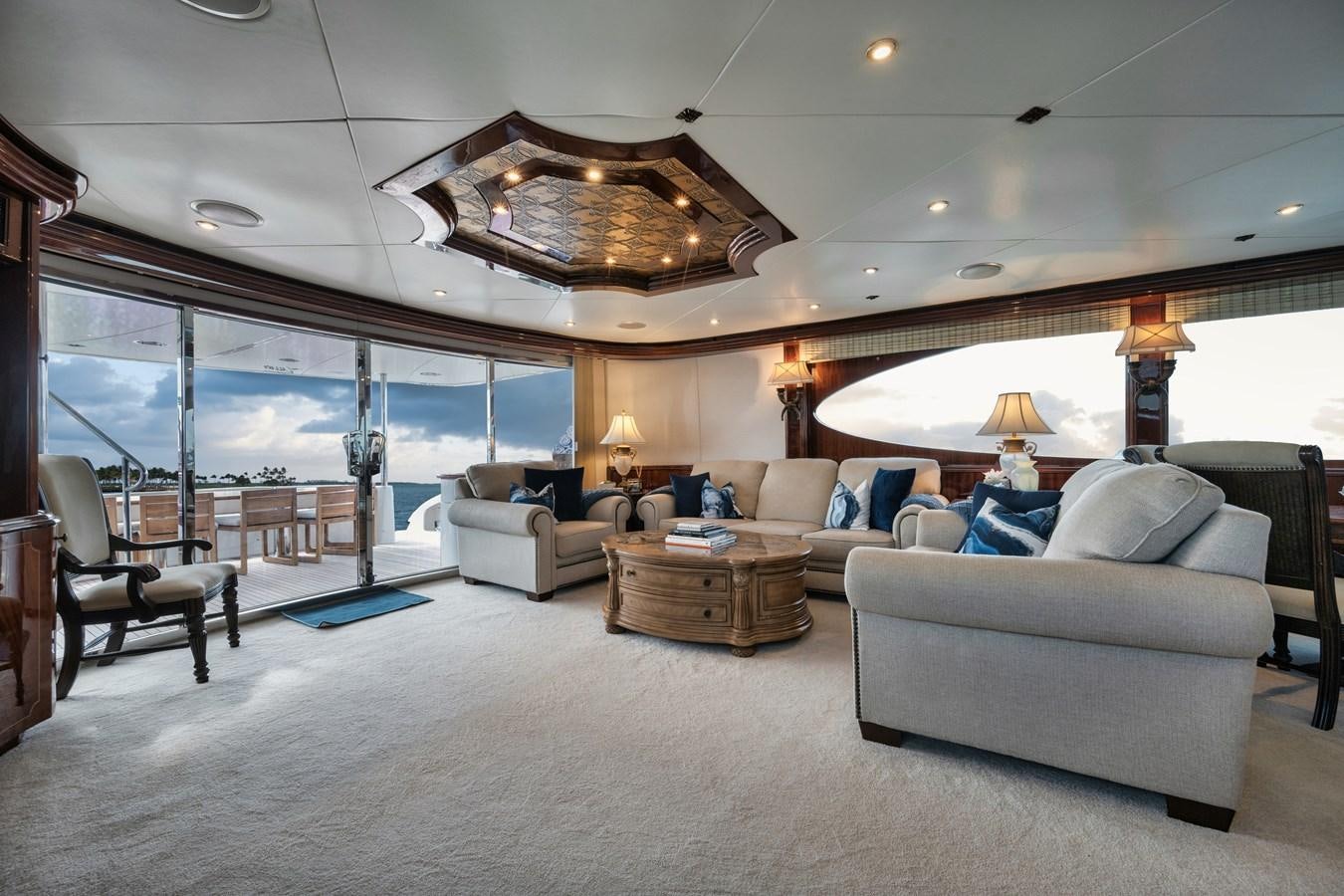 a living room with a large open window aboard BELLA CONTESSA Yacht for Sale