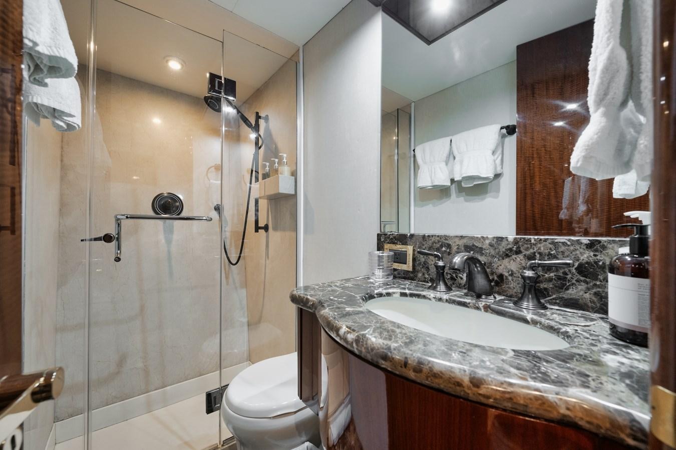 a bathroom with a sink and a toilet aboard BELLA CONTESSA Yacht for Sale