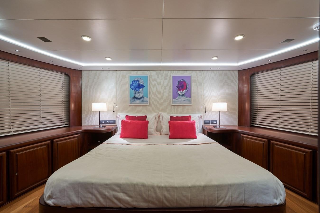 a large bed in a room aboard EL CARAN Yacht for Sale