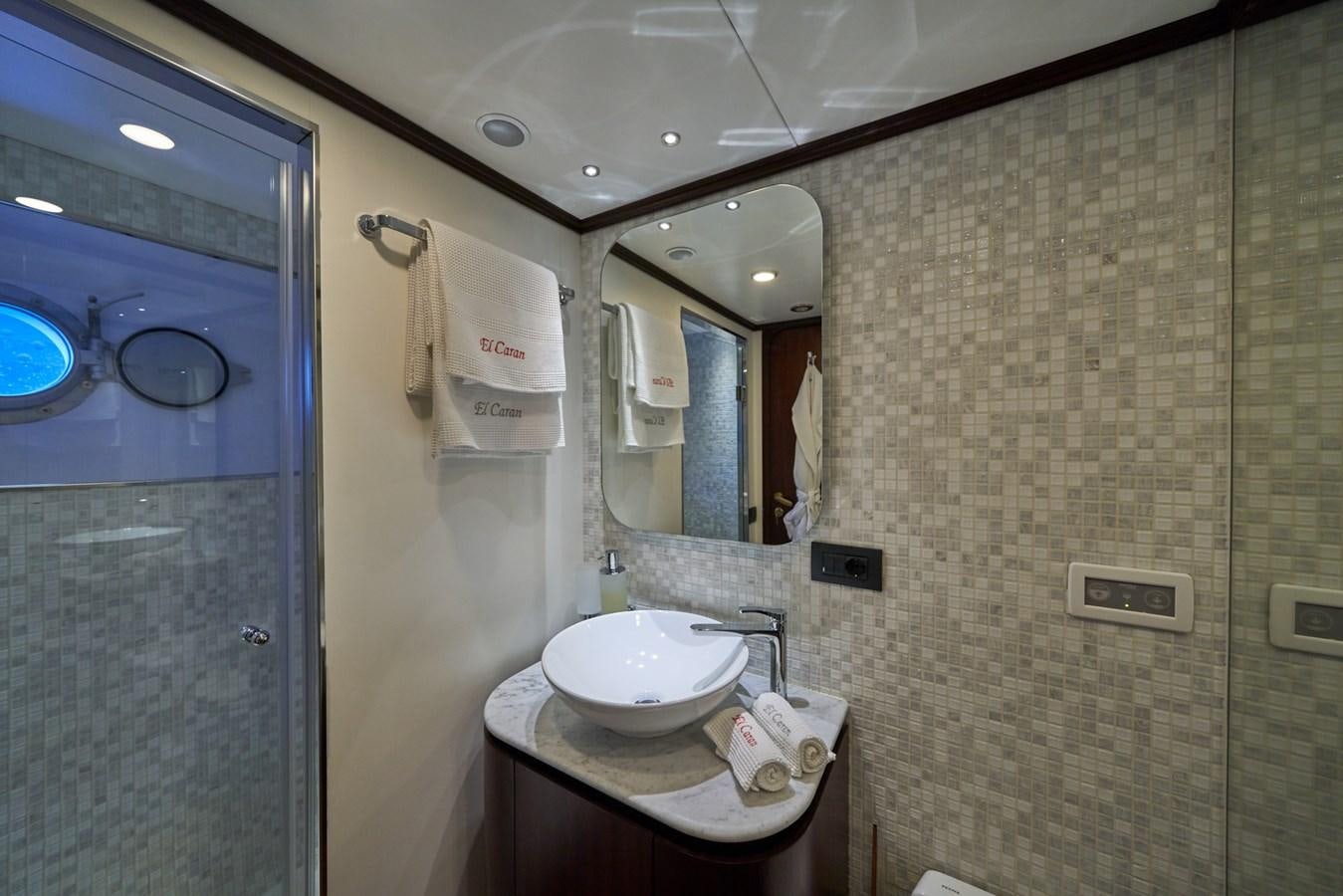 a bathroom with a sink and a mirror aboard EL CARAN Yacht for Sale