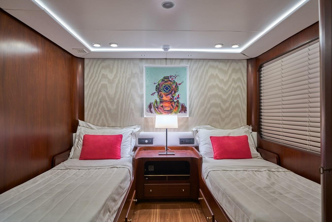 a couple of beds in a hotel room aboard EL CARAN Yacht for Sale