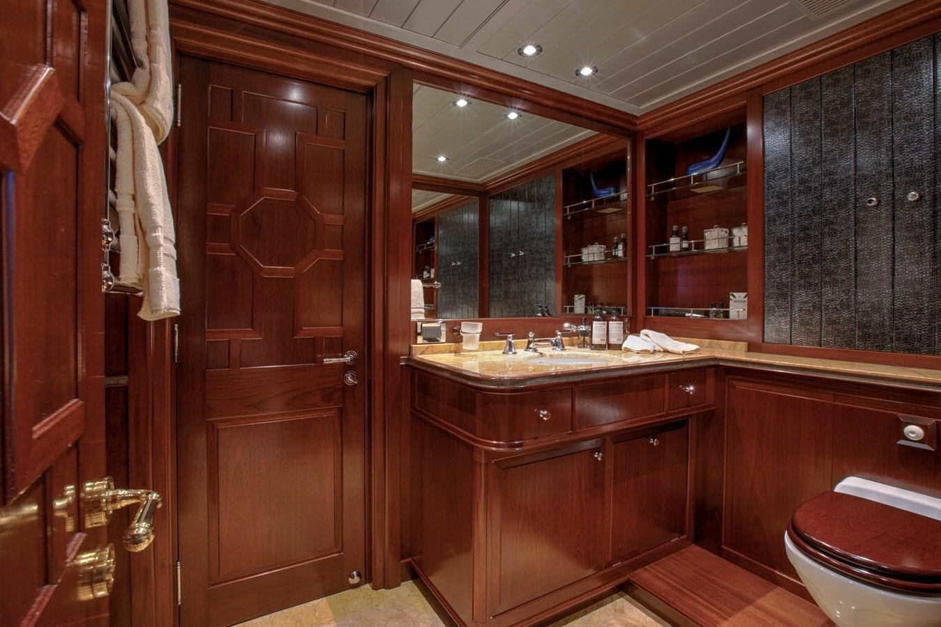 a bathroom with wooden cabinets aboard MARE NOSTRUM Yacht for Sale