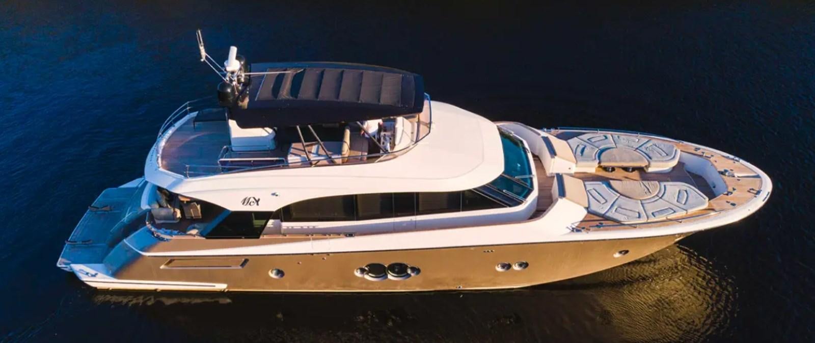 a white and gold boat with a black top and a black top aboard MANILA Yacht for Sale