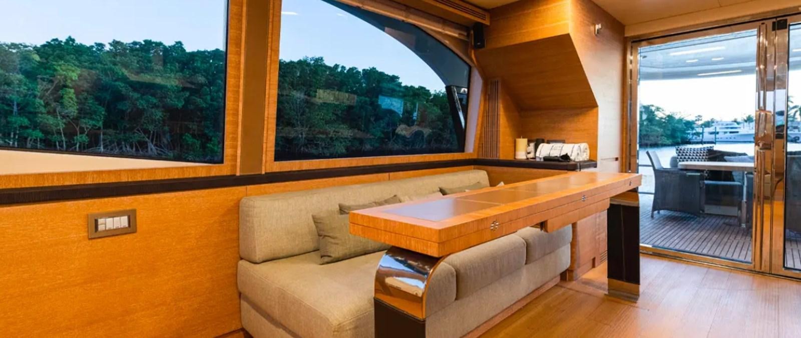 a living room with a large window aboard MANILA Yacht for Sale
